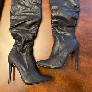 Black over the knee boot.